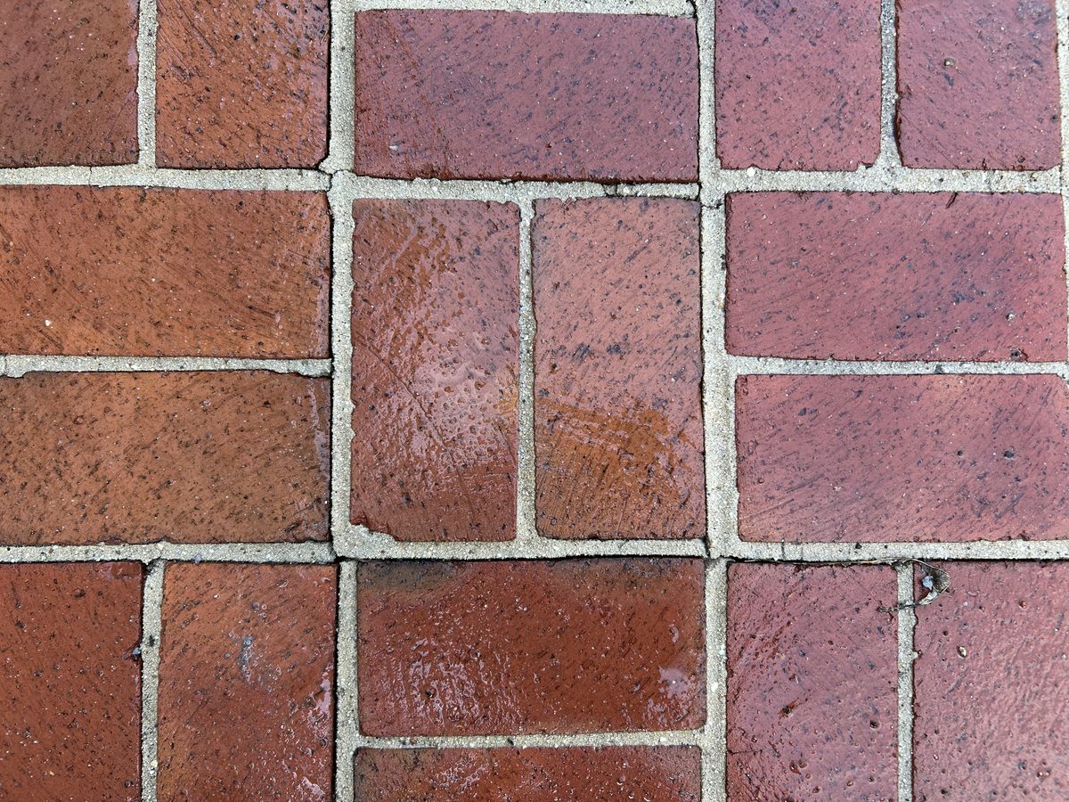 Restored red brick pavers after pressure washing in Fairfax County VA