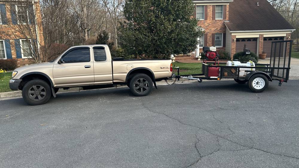 AHL Wash pickup truck towing the pressure washing rig on a trailer in Springfield VA